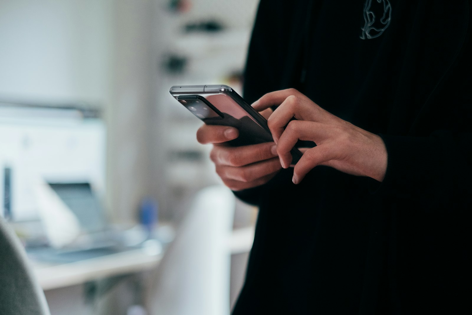 Person checking AI search results on a smartphone, representing Generative Engine Optimization